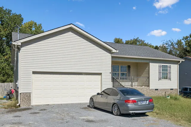 a car parked in front of a house