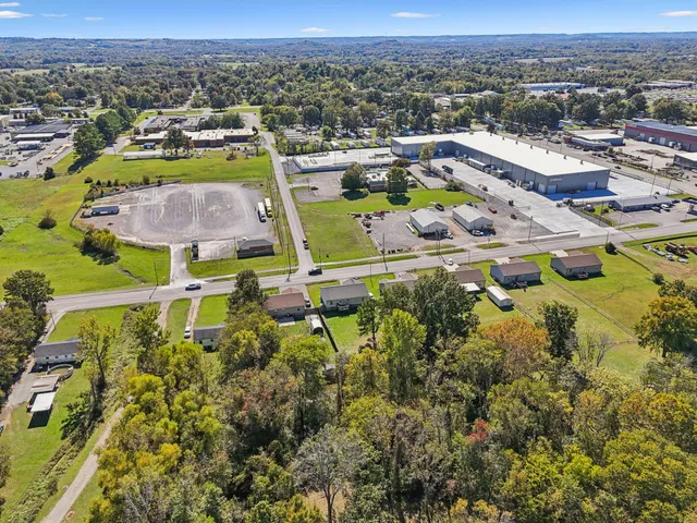 an aerial view of a house with a swimming pool