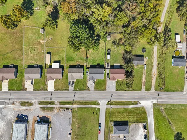 aerial view of a swimming pool with outdoor seating