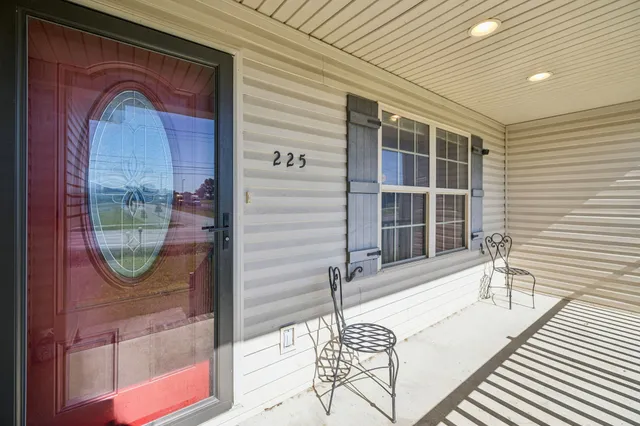 a view of a balcony with chair and the potted plant