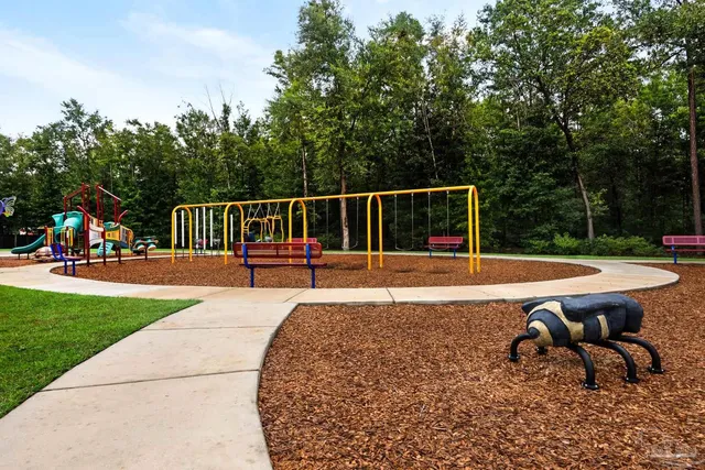 a view of a swimming pool with chairs