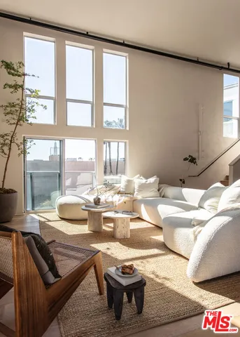 a room with furniture and a large window