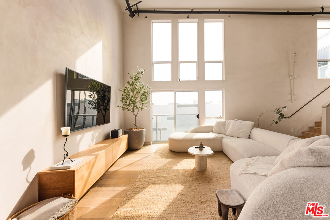 4215 Glencoe Avenue, Unit 405 Marina del Rey, CA 90292 - Photo 19 of 45 a living room with furniture and a large window