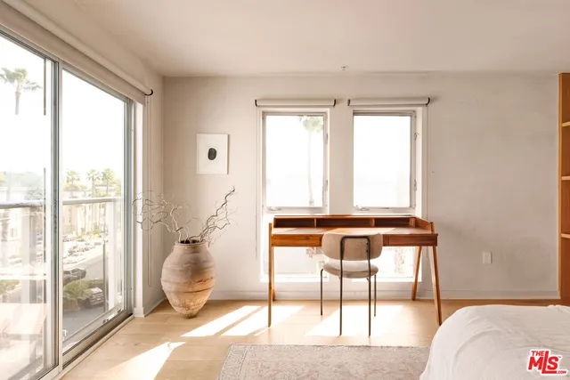 a living room with a large window and table