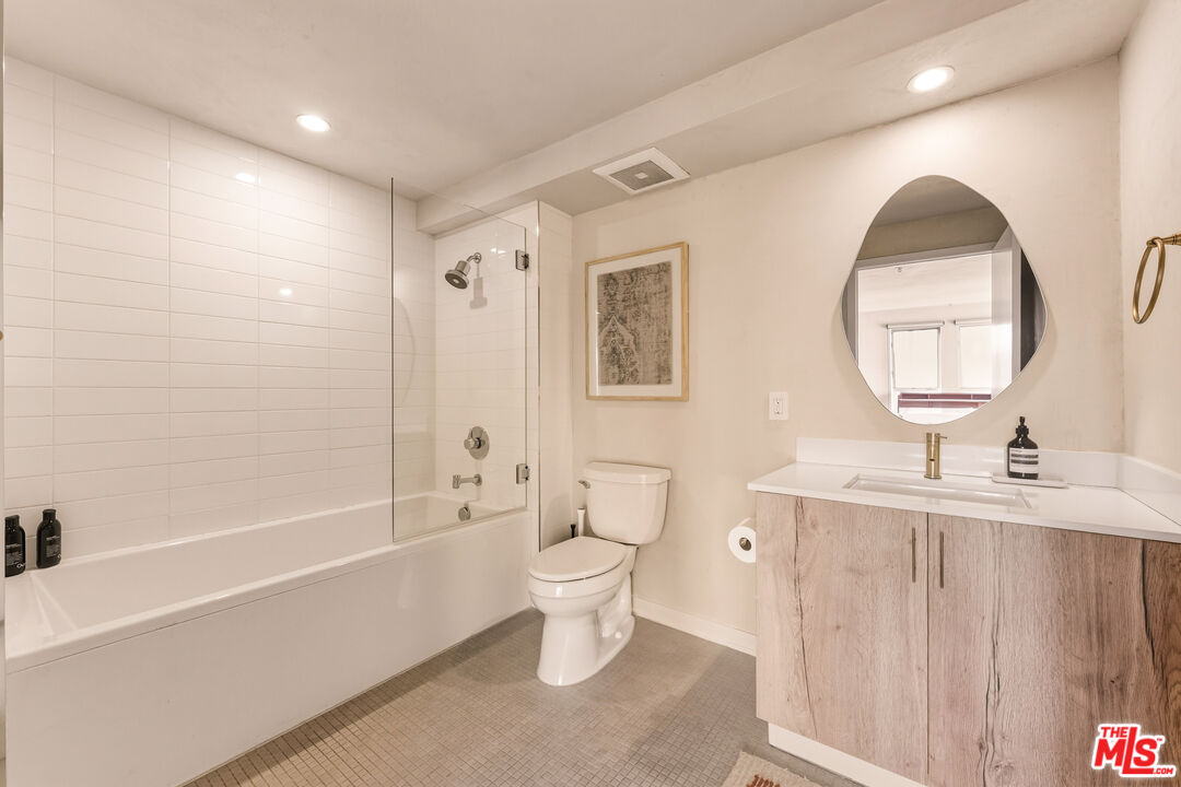 4215 Glencoe Avenue, Unit 405 Marina del Rey, CA 90292 - Photo 30 of 45 a bathroom with a sink a toilet and a mirror
