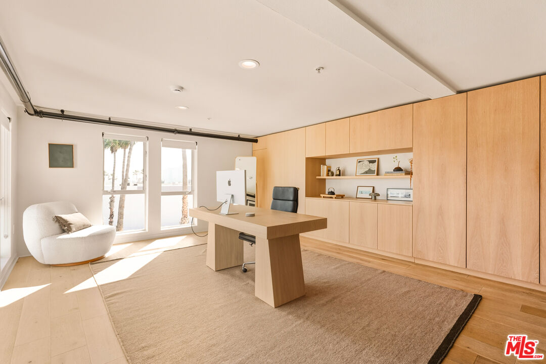 4215 Glencoe Avenue, Unit 405 Marina del Rey, CA 90292 - Photo 31 of 45 a living room with furniture a large window and kitchen view