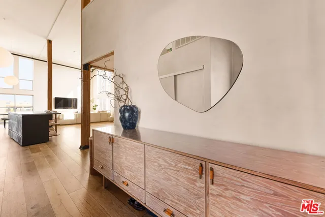 a view of living room with furniture and wooden floor