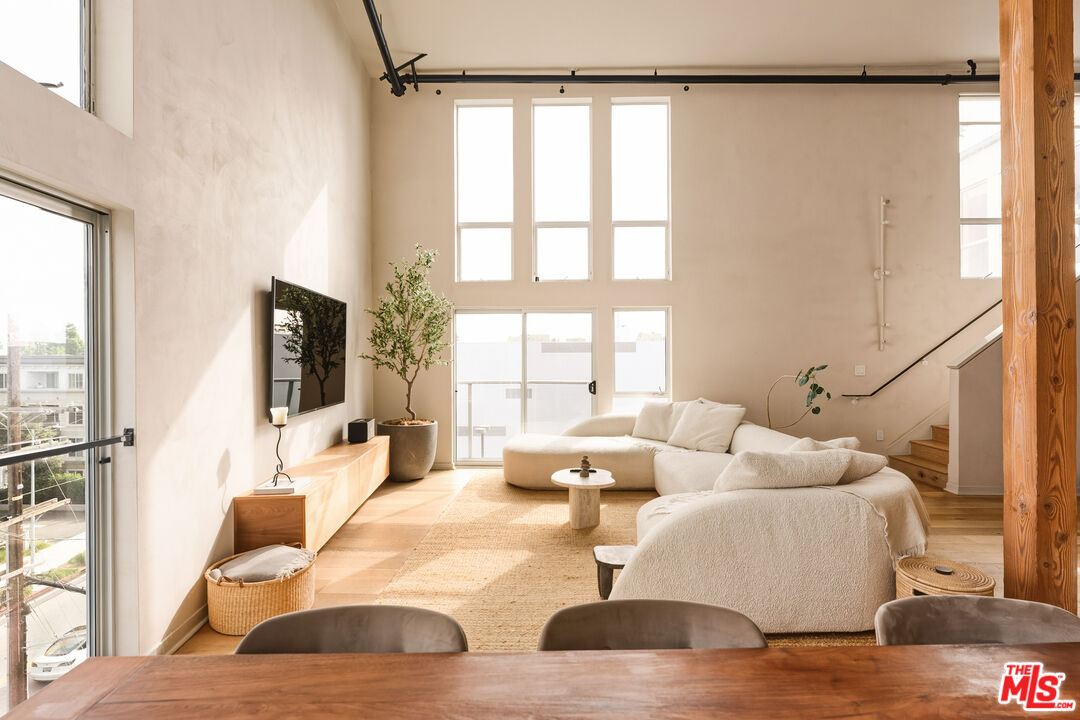 4215 Glencoe Avenue, Unit 405 Marina del Rey, CA 90292 - Photo 4 of 45 a living room with furniture and a large window
