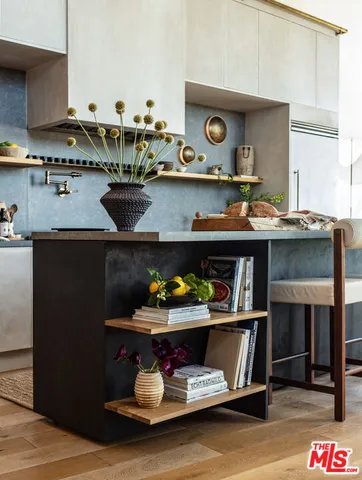 a kitchen with a stove and cabinets