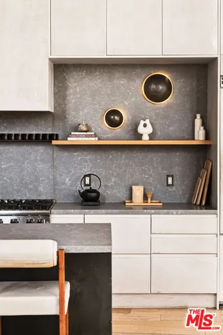 a kitchen with a stove and a microwave