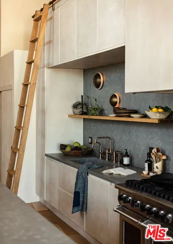 a kitchen with a stove and cabinets