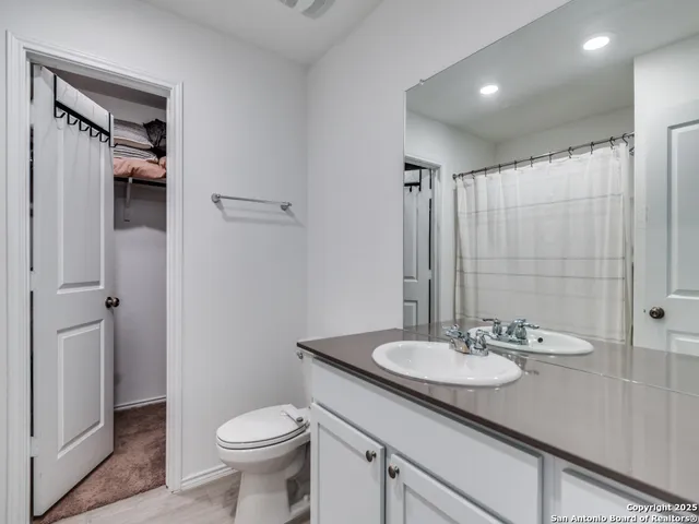 a view of a bedroom with baby bed and toys