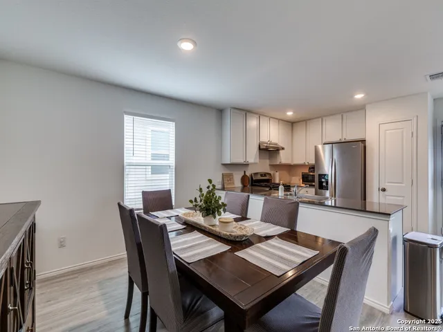 a view of a dining room with furniture