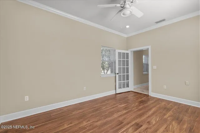 a view of bathroom with a granite countertop sink a toilet and a mirror