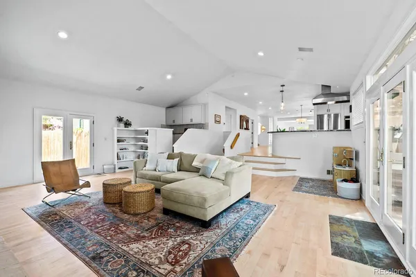 a living room with furniture and a rug