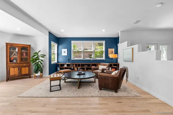 a living room with furniture and a window