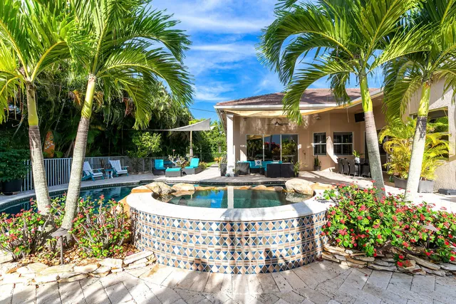 an aerial view of a house with outdoor space swimming pool and outdoor seating