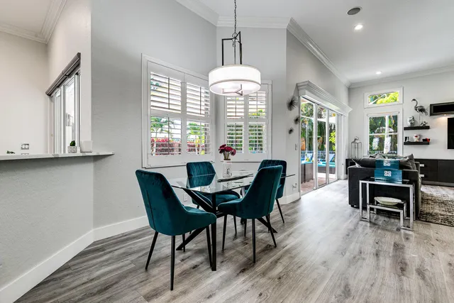 a view of a dining room with furniture window and wooden floor