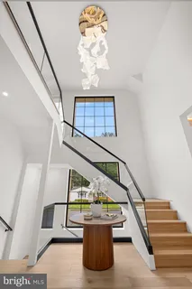 a large kitchen with kitchen island a large window