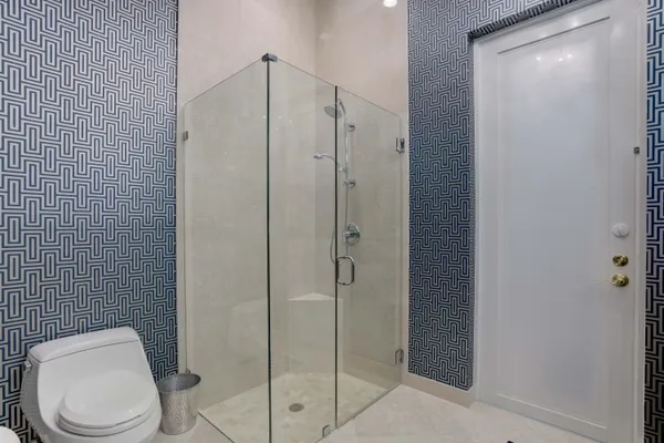 a bathroom with a bathtub and shower
