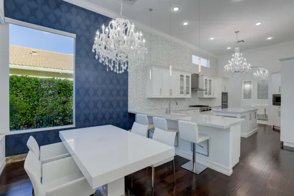 a kitchen with a refrigerator and a sink
