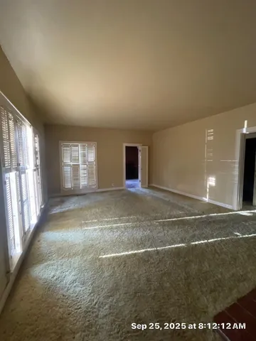 a view of an empty room and window