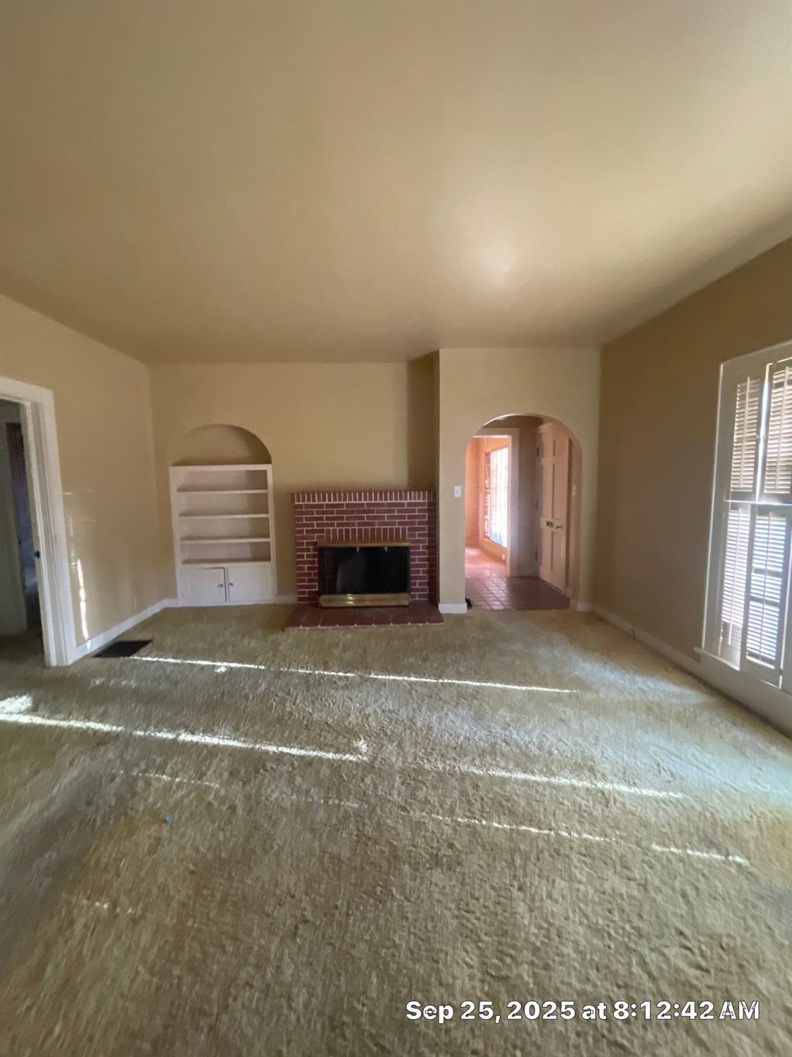 151 South Murdock Avenue Willows, CA 95988 - Photo 12 of 19 a view of empty room with a fireplace