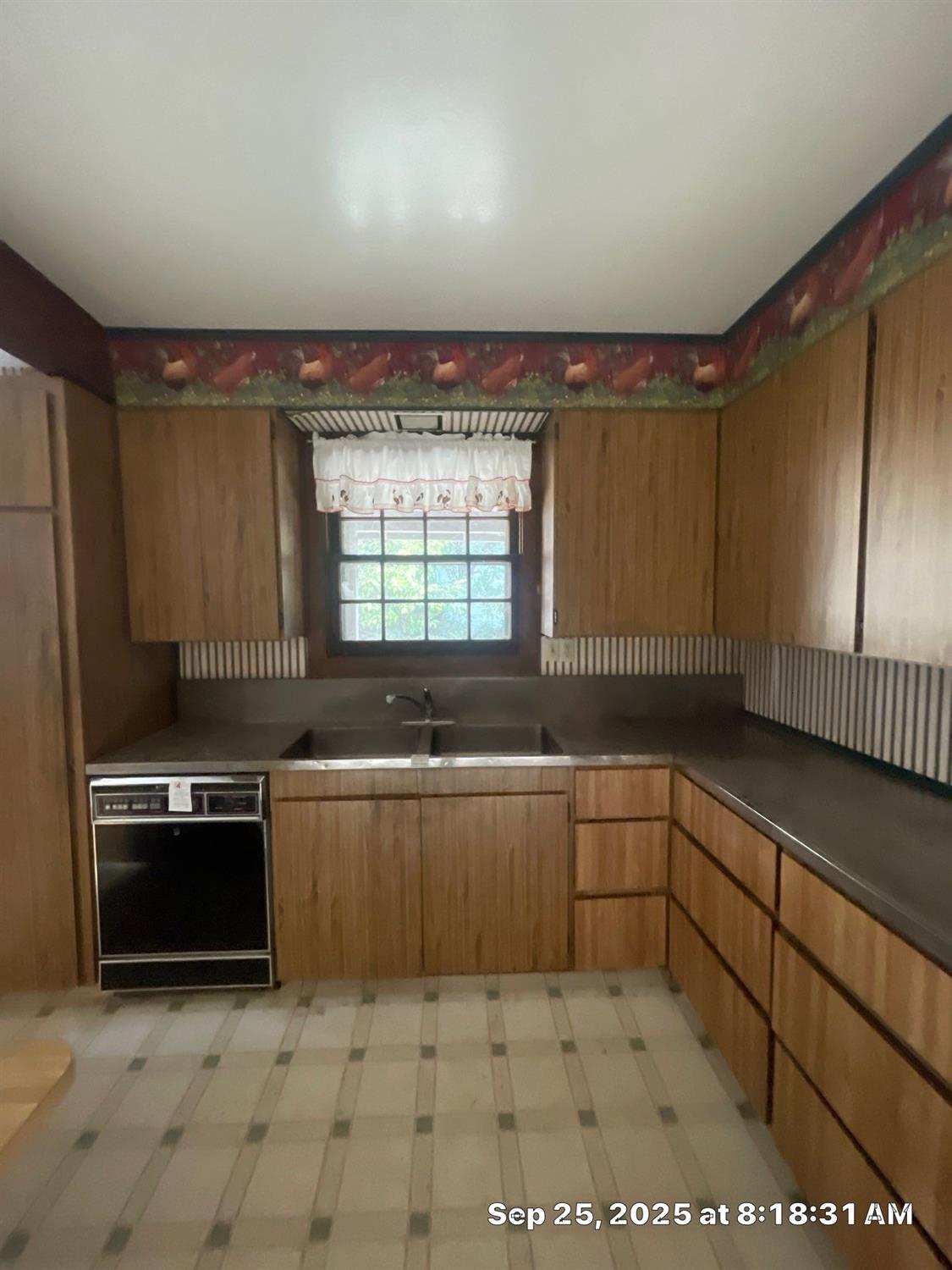 151 South Murdock Avenue Willows, CA 95988 - Photo 3 of 19 a kitchen with stainless steel appliances granite countertop a sink and a stove top oven