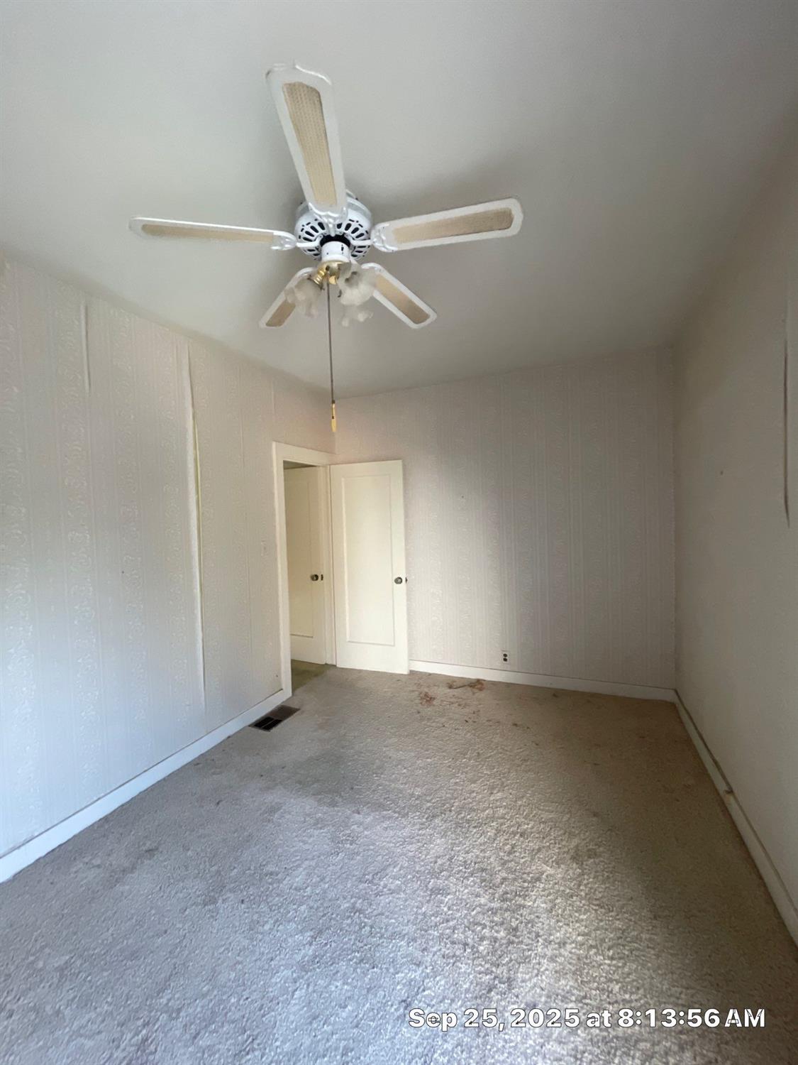 151 South Murdock Avenue Willows, CA 95988 - Photo 8 of 19 an empty room with chandelier fan