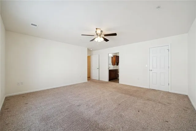 a bathroom with a sink vanity granite and toilet