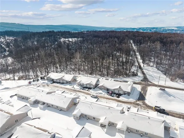 a kitchen with a stove and a chair