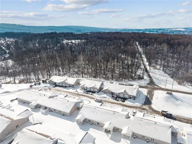 a kitchen with a stove and a chair