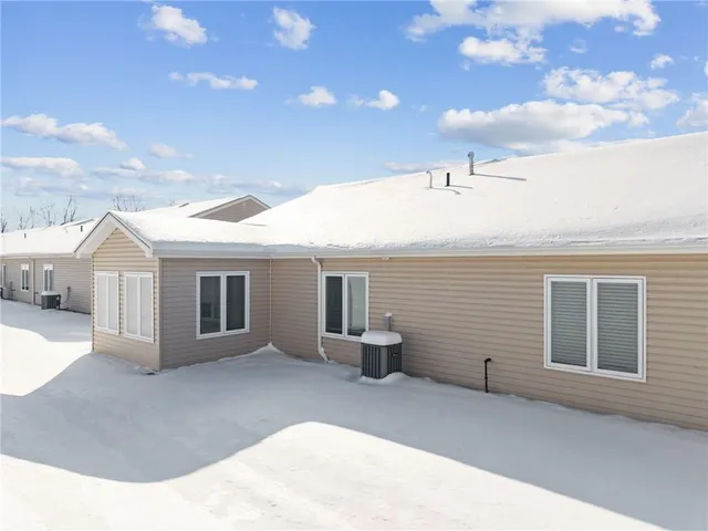a view of a house with backyard and porch