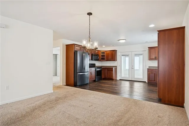 a view of a chandelier fan and entryway