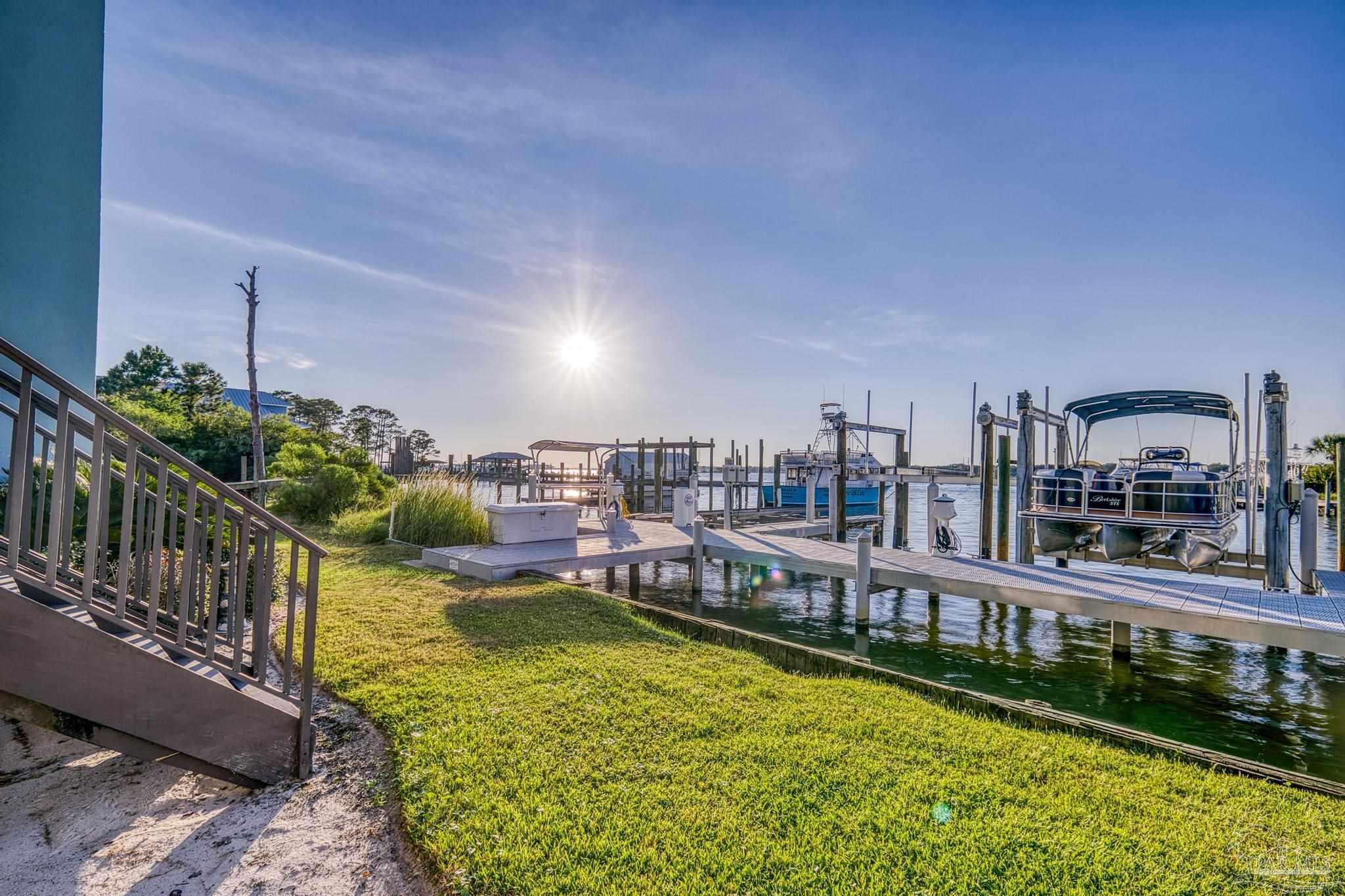 14100 River Road, Unit 112A Pensacola, FL 32507 - Photo 11 of 64 a view of a swimming pool with a patio