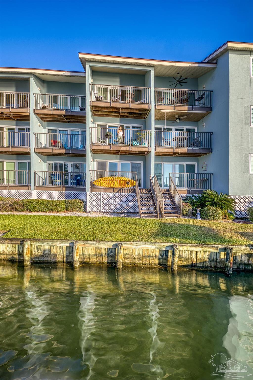 14100 River Road, Unit 112A Pensacola, FL 32507 - Photo 18 of 64 a swimming pool view with a outdoor seating space