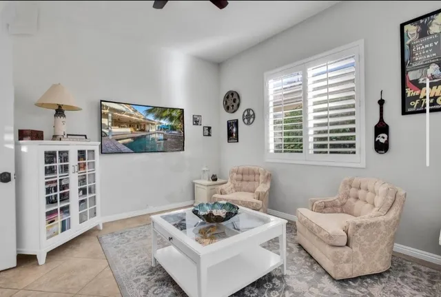 a bed room with a bed and a television