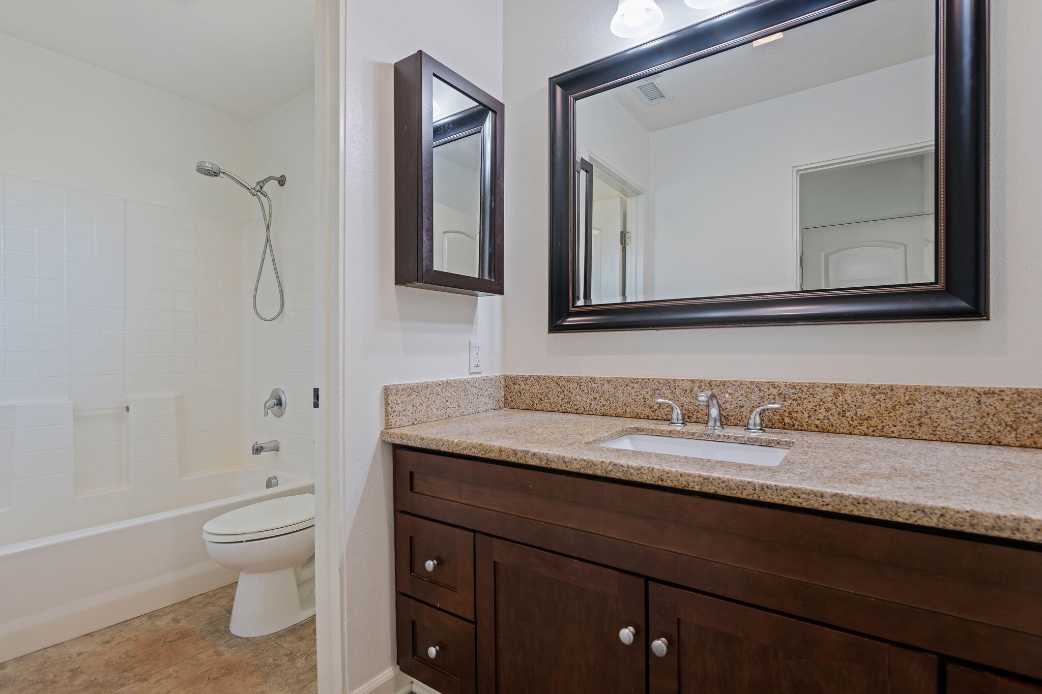 330 West Canon Perdido Street Santa Barbara, CA 93101 - Photo 16 of 44 a bathroom with a granite countertop toilet sink and mirror