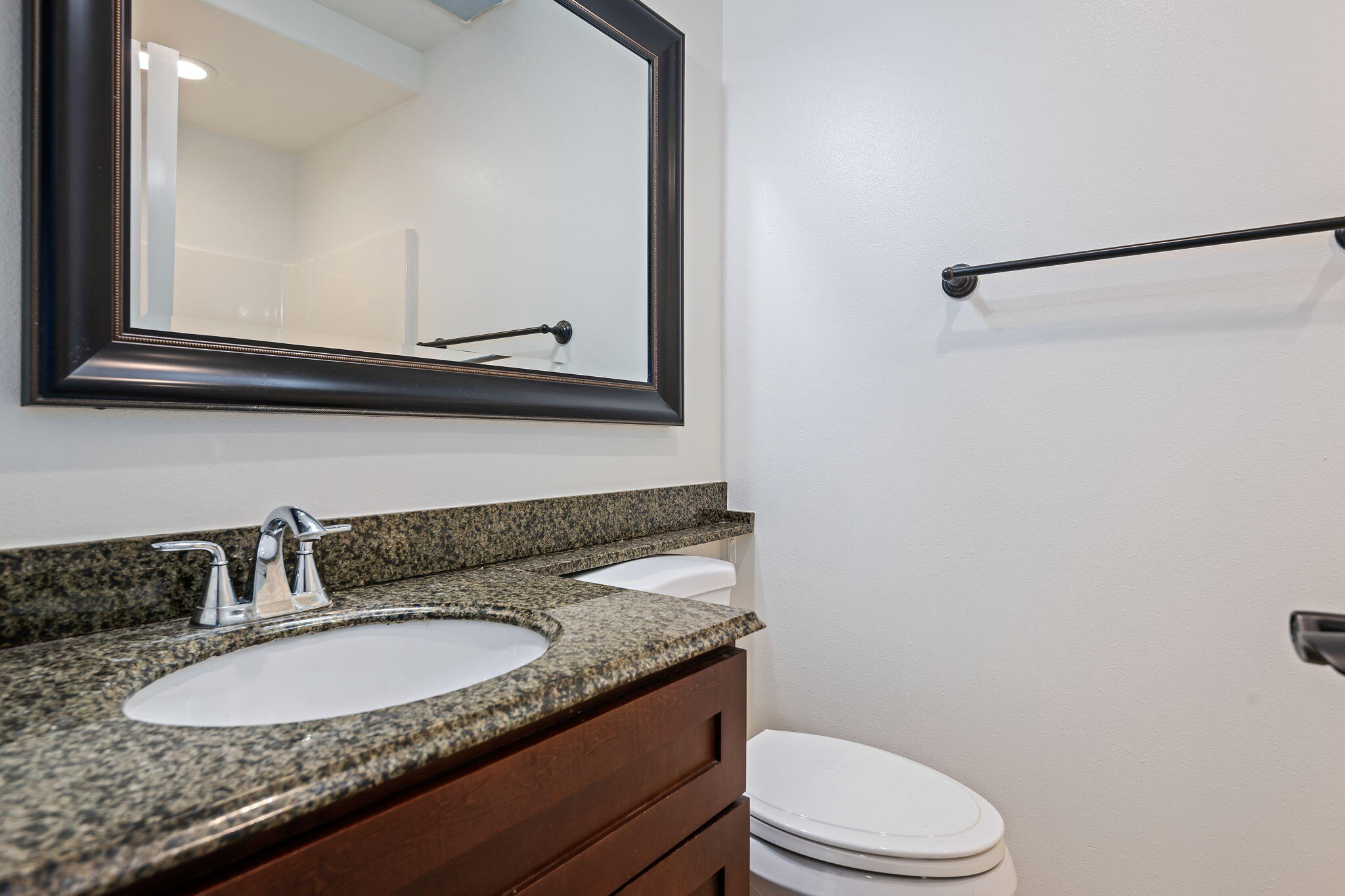 330 West Canon Perdido Street Santa Barbara, CA 93101 - Photo 19 of 44 a bathroom with a granite countertop sink and a mirror