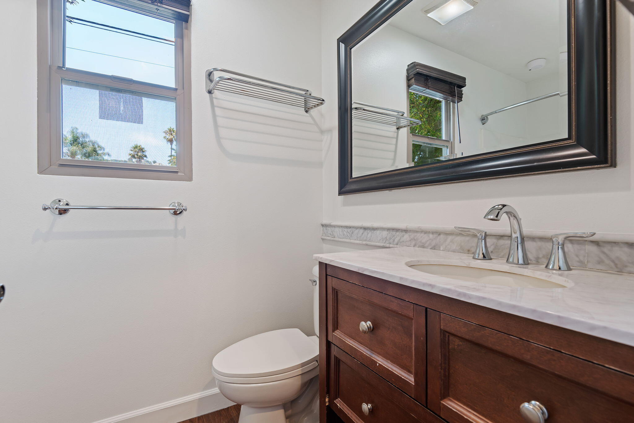 330 West Canon Perdido Street Santa Barbara, CA 93101 - Photo 21 of 44 a bathroom with a granite countertop toilet sink and mirror