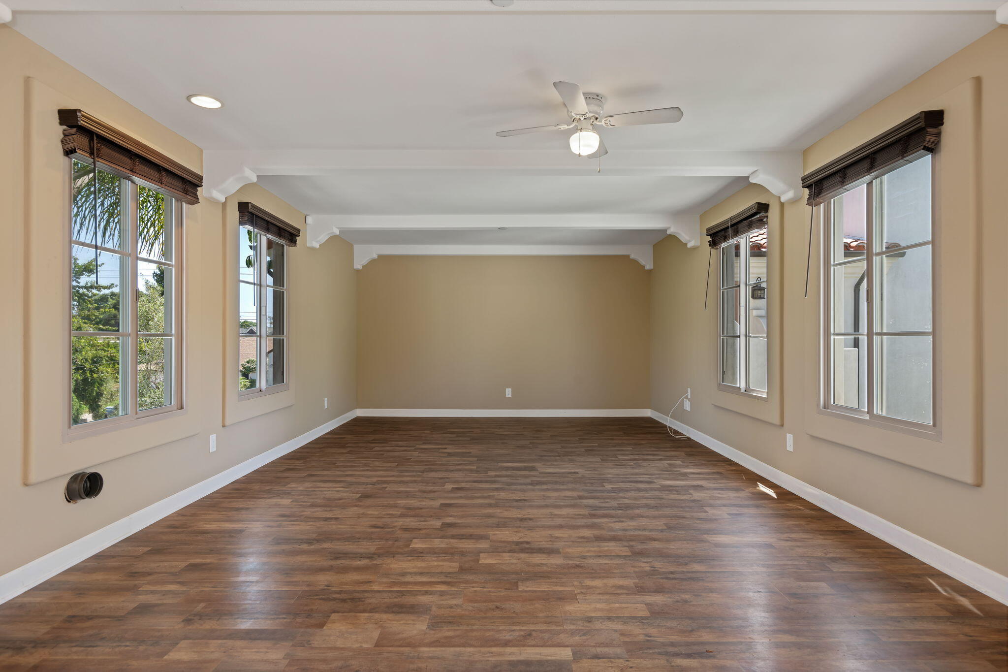 330 West Canon Perdido Street Santa Barbara, CA 93101 - Photo 31 of 44 a view of an empty room with wooden floor and a window