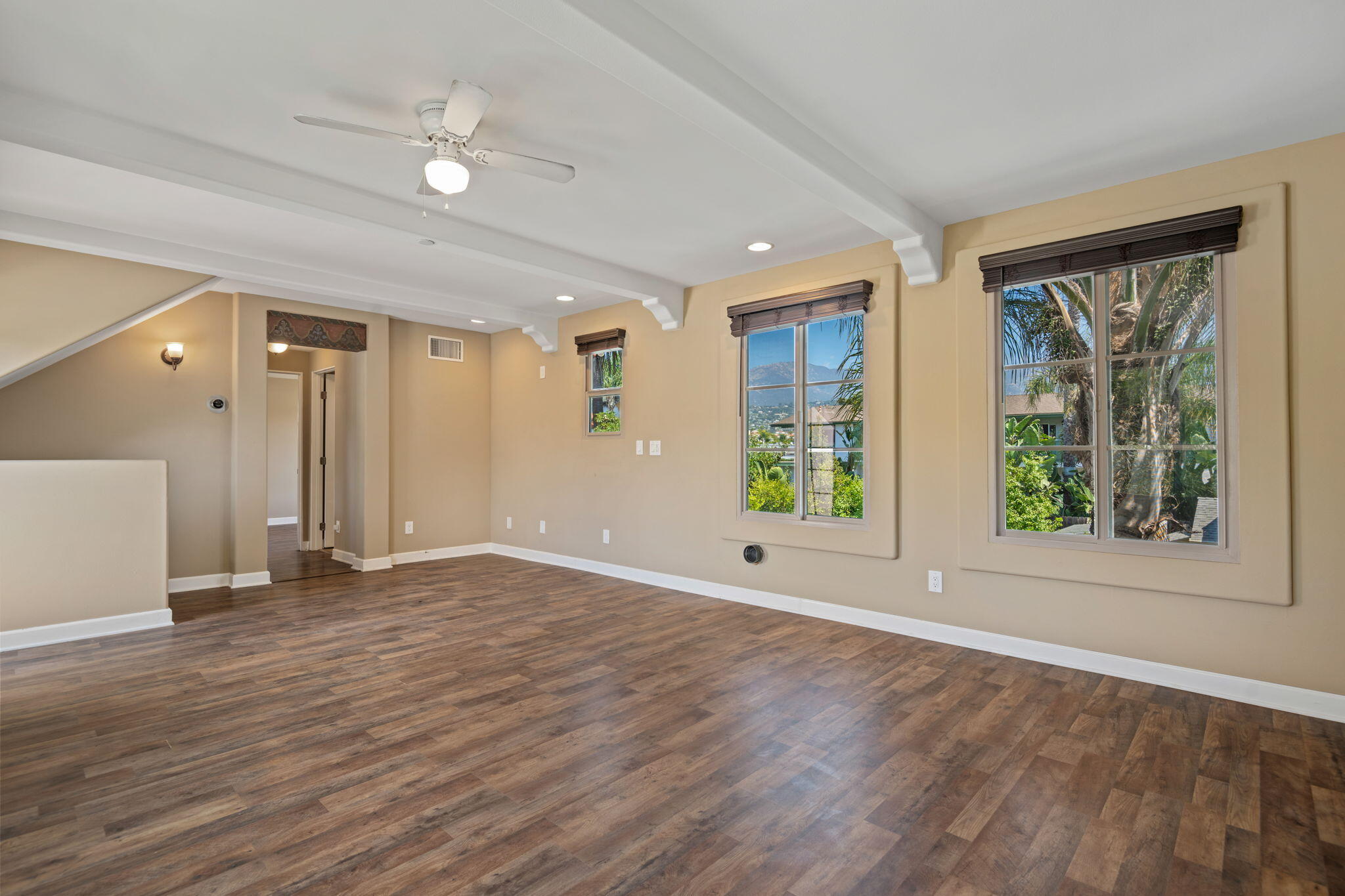 330 West Canon Perdido Street Santa Barbara, CA 93101 - Photo 34 of 44 a view of an empty room with wooden floor and a window