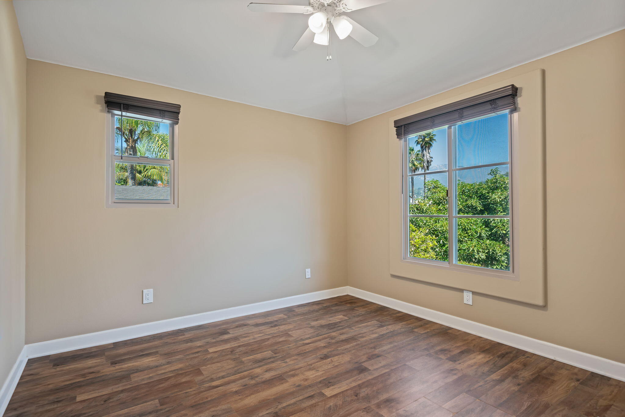 330 West Canon Perdido Street Santa Barbara, CA 93101 - Photo 37 of 44 a view of an empty room with wooden floor and a window