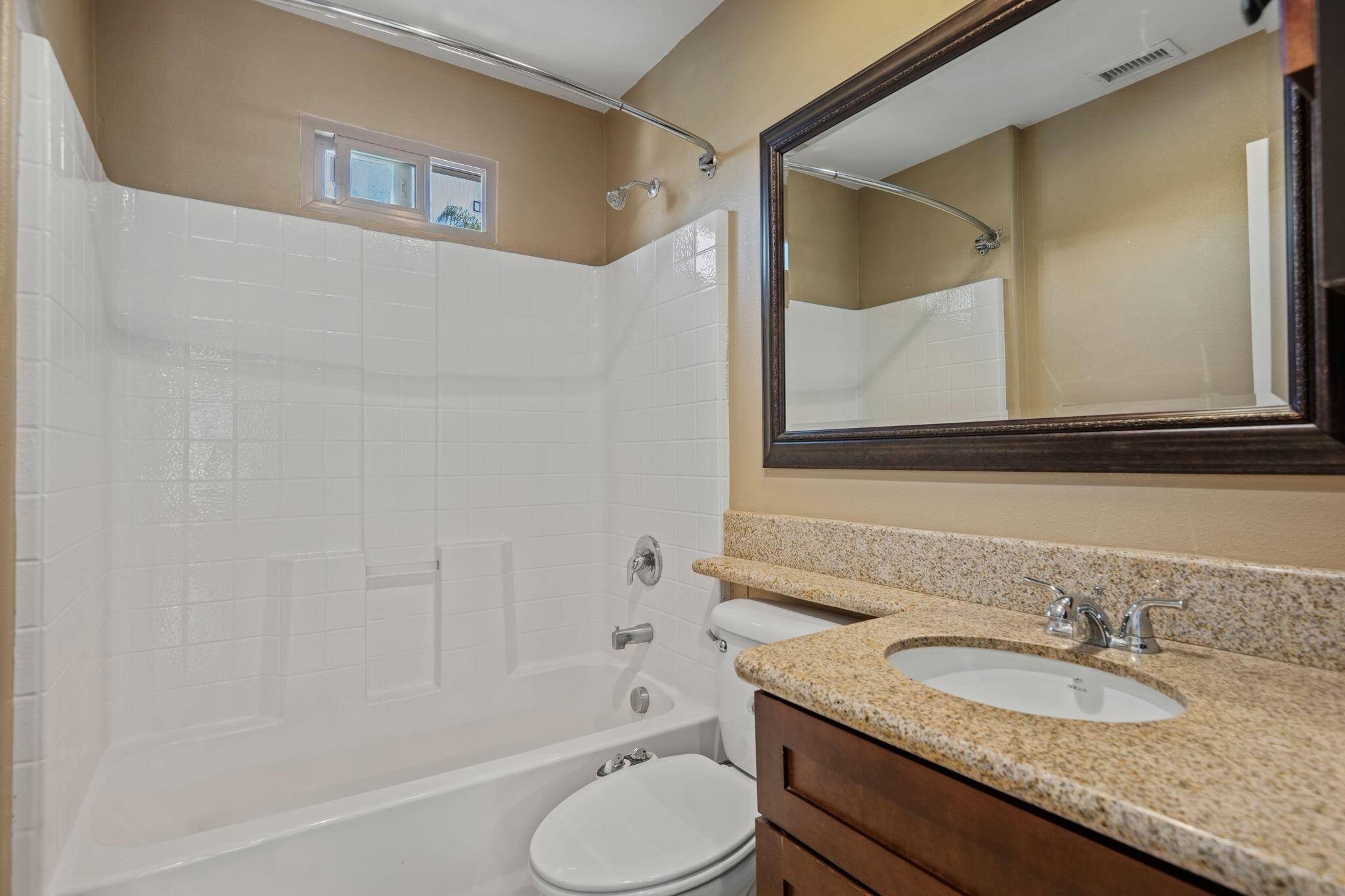 330 West Canon Perdido Street Santa Barbara, CA 93101 - Photo 38 of 44 a bathroom with a granite countertop sink toilet and a mirror