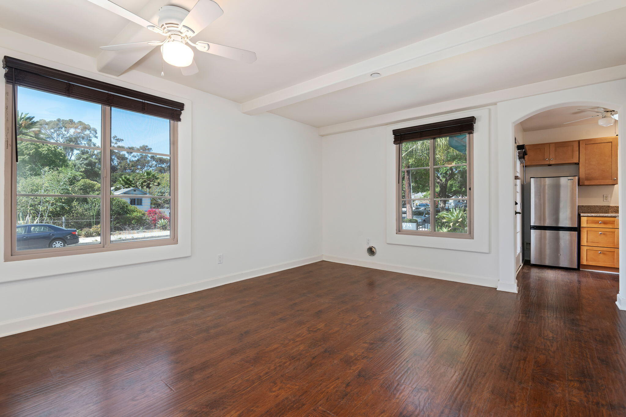 330 West Canon Perdido Street Santa Barbara, CA 93101 - Photo 4 of 44 a view of an empty room with wooden floor and a window