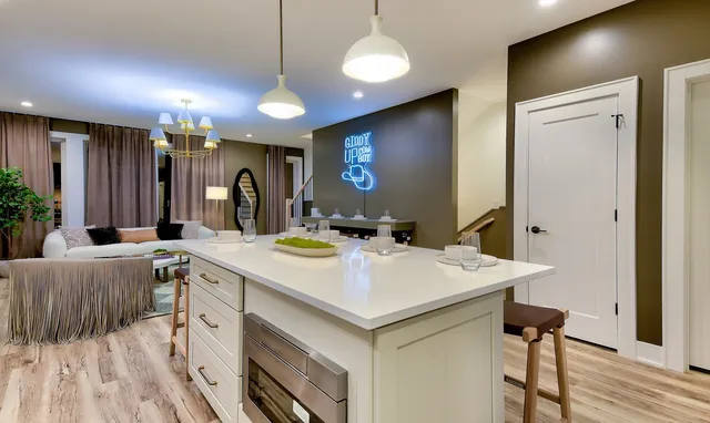 a view of a kitchen counter space and wooden floor