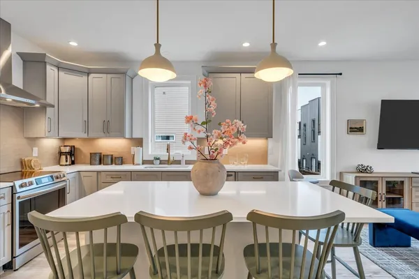 a view of a dining room with furniture window and wooden floor