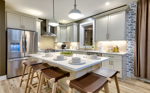 a kitchen with a sink stove and refrigerator