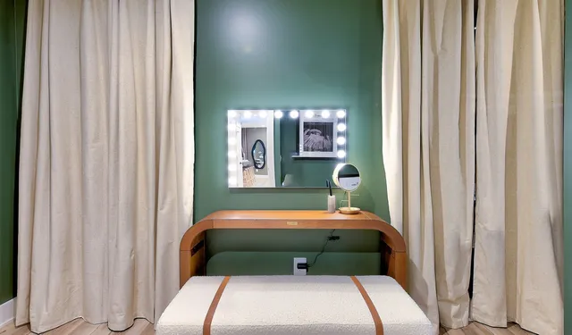 a bathroom with a sink mirror toilet and shower