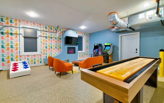 a bedroom with furniture and a window